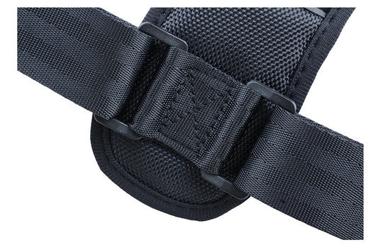 Close-up of a black tactical belt with buckle on a white background